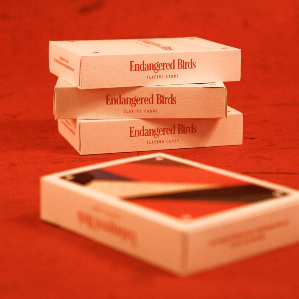 stack of playing card decks on red background