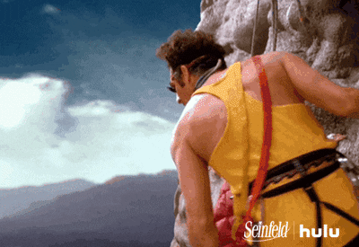 Gif of two Seinfeld characters rock climbing