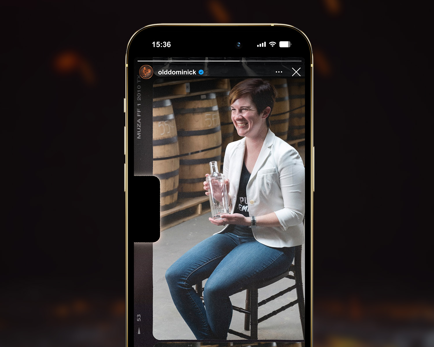 Master distiller, Alex Castle, in a video on a phone screen.