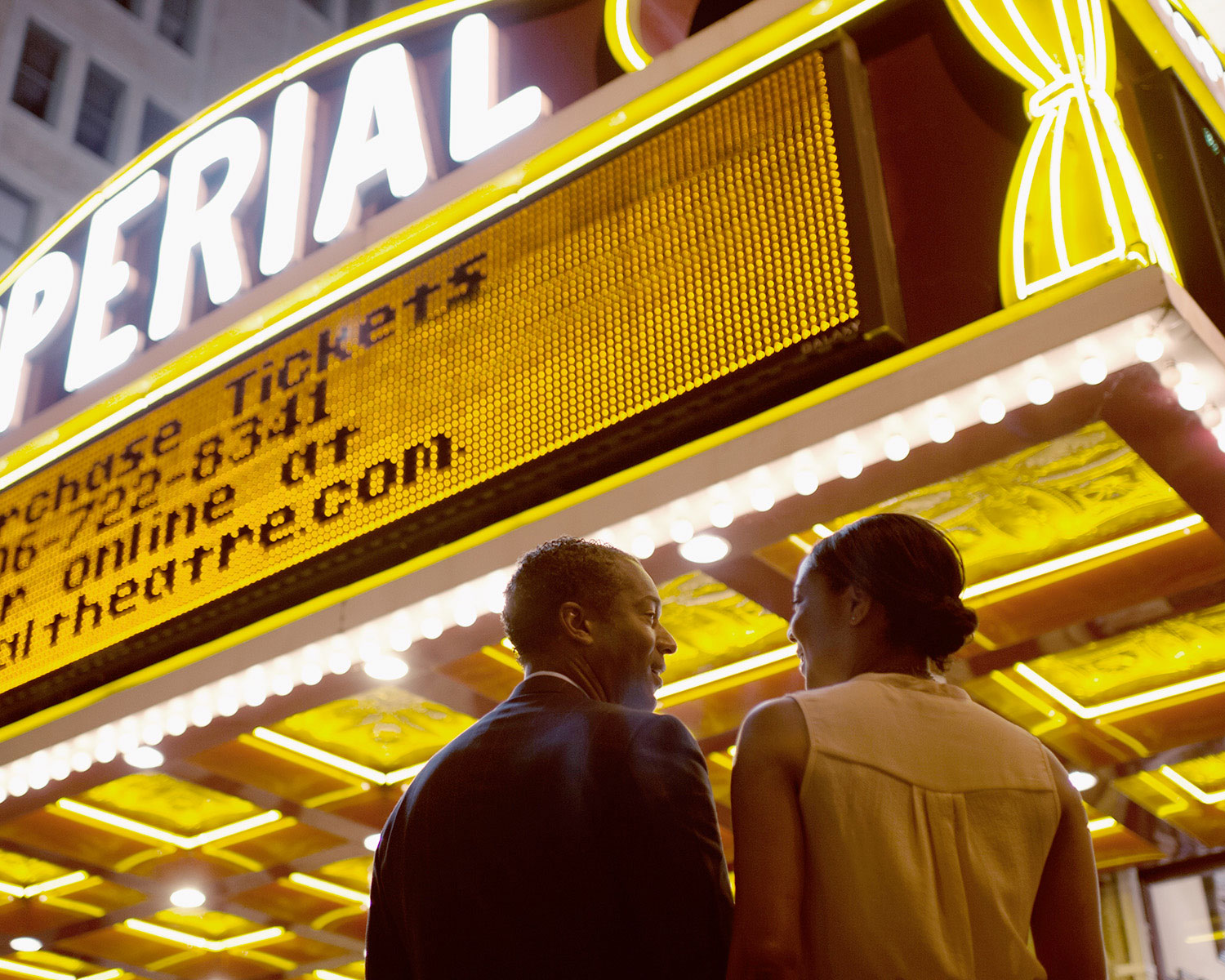 Couple going into the theatre.