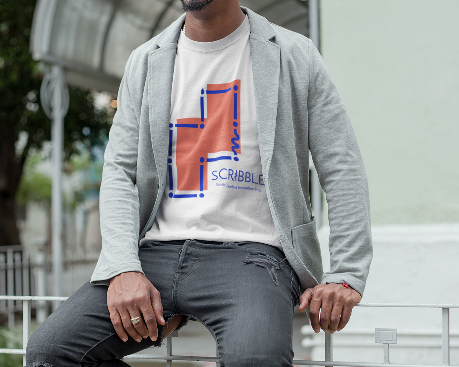 Man wearing Scribble shirt.